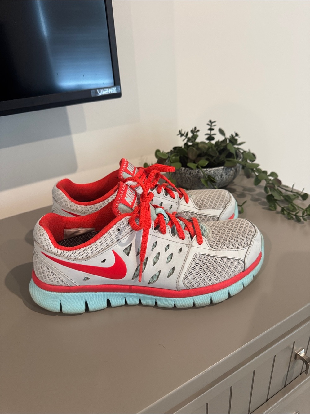 Nike Grey Athletic Sneakers with Red Accents and baby blue Sole